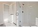 Modern bathroom with a glass shower and linen closet at 754 Trevett Way, Marietta, GA 30062