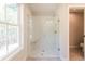 Bathroom with glass walk in shower and a window at 754 Trevett Way, Marietta, GA 30062