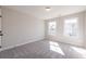 Bright bedroom with a double window, neutral colored walls and carpet at 754 Trevett Way, Marietta, GA 30062