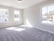 Bright bedroom featuring neutral colored walls and carpet, plus a double window at 754 Trevett Way, Marietta, GA 30062