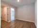 Bedroom with hardwood floors and open doorways at 754 Trevett Way, Marietta, GA 30062