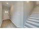 Light and airy entryway with staircase and front door at 754 Trevett Way, Marietta, GA 30062