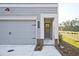 Attached garage with gray doors and brick accents at 754 Trevett Way, Marietta, GA 30062