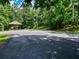 Outdoor pavilion with picnic tables offers a place to relax near a tree lined street at 754 Trevett Way, Marietta, GA 30062