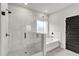 Modern bathroom featuring a soaking tub and a herringbone-patterned shower at 8950 Callaway Dr, Winston, GA 30187