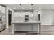 Modern kitchen with white cabinets, large island, and stainless steel appliances at 8950 Callaway Dr, Winston, GA 30187