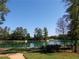 Scenic pond with walking path and lush trees at 11555 Chatham Dr, Hampton, GA 30228