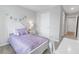 Charming bedroom with a twin bed and white furniture at 11559 Chatham Dr, Hampton, GA 30228