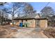 Back of house with small yard and trash cans at 28 Gertrude Pl, Atlanta, GA 30318