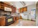 Dated kitchen features worn cabinets and appliances at 28 Gertrude Pl, Atlanta, GA 30318