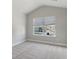 Bedroom with window seat, neutral wall colors and carpeted floors at 3686 Lockaby Way, Lawrenceville, GA 30044