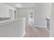 Upstairs hallway with neutral wall colors and carpeted floors at 3686 Lockaby Way, Lawrenceville, GA 30044