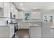 Modern kitchen with stainless steel appliances and granite countertops at 3686 Lockaby Way, Lawrenceville, GA 30044