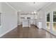 Bright kitchen with white cabinets, granite counters, and stainless steel appliances at 3686 Lockaby Way, Lawrenceville, GA 30044