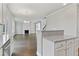 Kitchen with granite countertops and a view into the living room at 3686 Lockaby Way, Lawrenceville, GA 30044