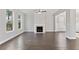 Spacious living room featuring hardwood floors and a fireplace at 3686 Lockaby Way, Lawrenceville, GA 30044