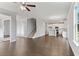 Spacious living room with hardwood floors and a view into the kitchen area at 3686 Lockaby Way, Lawrenceville, GA 30044