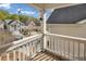 Private balcony with a wooden deck and a view of the neighborhood at 593 Shadow Valley Ct, Lithonia, GA 30058