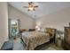 Bedroom with a queen bed and a ceiling fan at 593 Shadow Valley Ct, Lithonia, GA 30058