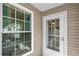 Exterior view of the home showing a window and a white door at 593 Shadow Valley Ct, Lithonia, GA 30058