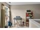 Small home office featuring a keyboard, guitar, and shelving at 593 Shadow Valley Ct, Lithonia, GA 30058