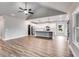 Open living room with vaulted ceiling and kitchen island at 8870 Callaway Dr, Winston, GA 30187