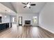 Living room features hardwood floors, a stone fireplace, and access to the back patio at 8920 Callaway Dr, Winston, GA 30187