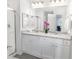 Elegant bathroom with double vanity and granite countertop at 11571 Chatham Dr, Hampton, GA 30228