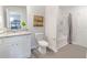 Simple bathroom with a toilet, tub, and vanity at 11571 Chatham Dr, Hampton, GA 30228