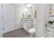 Clean bathroom with single vanity and tub shower combo at 11571 Chatham Dr, Hampton, GA 30228