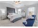 Spacious primary bedroom with plush carpet and large windows at 11571 Chatham Dr, Hampton, GA 30228
