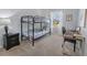 Bright bedroom featuring a bunk bed and workspace at 11571 Chatham Dr, Hampton, GA 30228