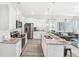 Open kitchen with stainless steel appliances and granite island at 11571 Chatham Dr, Hampton, GA 30228