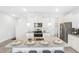 Bright and airy kitchen featuring granite countertops and stainless steel appliances at 11571 Chatham Dr, Hampton, GA 30228