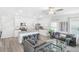 Spacious living room with fireplace, large windows and comfortable seating at 11571 Chatham Dr, Hampton, GA 30228