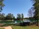 Peaceful pond with walking path and lush greenery at 11571 Chatham Dr, Hampton, GA 30228