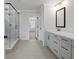 Elegant bathroom with double vanity, large shower, and soaking tub at 4074 Hosch Retreat Dr, Buford, GA 30519