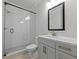 Clean bathroom with a walk-in shower, white subway tile, and modern vanity at 4074 Hosch Retreat Dr, Buford, GA 30519