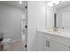 Simple bathroom with white vanity and a quartz countertop at 4074 Hosch Retreat Dr, Buford, GA 30519