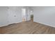 Well-lit bedroom featuring wood-look floors and an ensuite bathroom at 4074 Hosch Retreat Dr, Buford, GA 30519