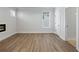 Spacious bedroom with hardwood floors and a modern fireplace at 4074 Hosch Retreat Dr, Buford, GA 30519