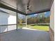 Covered patio with ceiling fan, offering backyard views at 4074 Hosch Retreat Dr, Buford, GA 30519