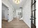 Bright entryway with hardwood floors, decorative wall, and views to the living areas at 4074 Hosch Retreat Dr, Buford, GA 30519