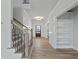 Bright foyer featuring hardwood floors and built-in shelving at 4074 Hosch Retreat Dr, Buford, GA 30519