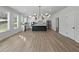 Modern kitchen with white cabinets, an island, and stainless steel appliances at 4074 Hosch Retreat Dr, Buford, GA 30519