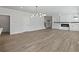 Spacious living room with fireplace and modern chandelier at 4074 Hosch Retreat Dr, Buford, GA 30519