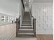 Elegant staircase with modern metal railing at 4074 Hosch Retreat Dr, Buford, GA 30519