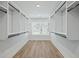 Bright walk-in closet with custom built-ins and natural light at 4074 Hosch Retreat Dr, Buford, GA 30519