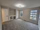 Bright bedroom featuring neutral walls, carpet, two windows and a built in desk area at 6002 Pat Mell Se Pl, Smyrna, GA 30080