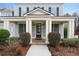 Inviting front porch with stylish columns, beautiful landscaping, and elegant entry door welcomes you home at 6484 Century Park Se Pl, Mableton, GA 30126